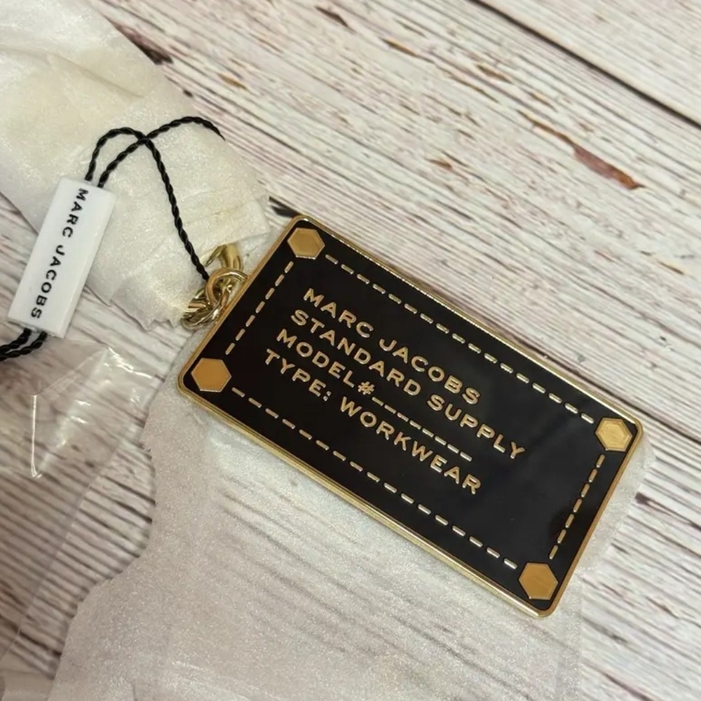 Marc Jacobs Black and Gold Tag